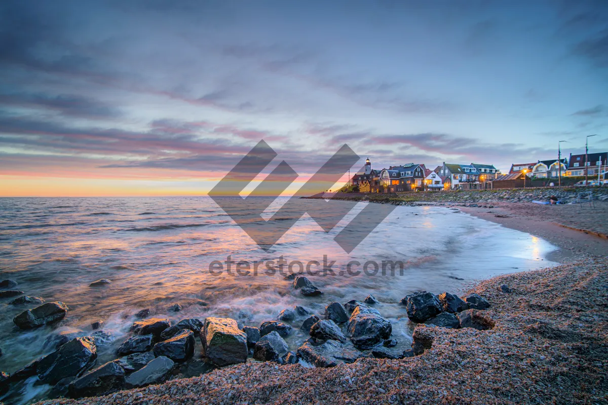 Picture of Sunset view of shipwreck on coastal rocks