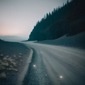 Scenic Mountain Road Amidst Alpine Landscape