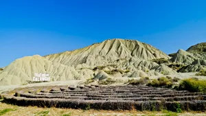 Ancient Mountain Stone Structure Amidst Desert Highland Landscape