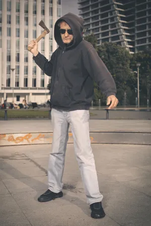 Happy man skateboarding outdoors on a vehicle - Image Title