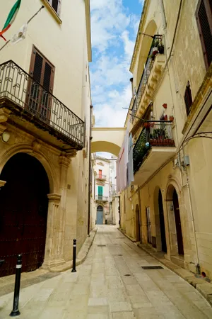 Historic cathedral tower in old city street view.