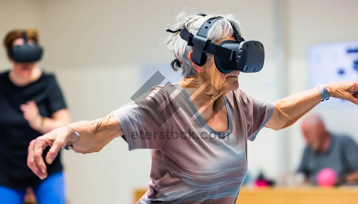 Picture of Professional Photographer Wearing Goggles and Mask in Studio