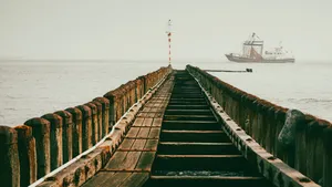 Skyline view of coastal bridge with clouds