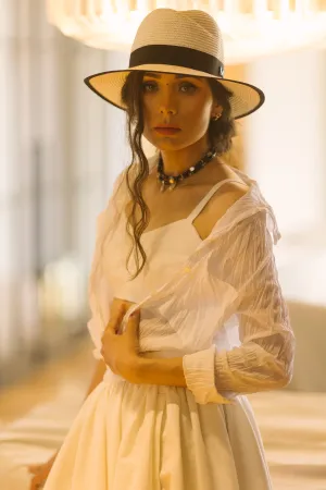 Happy brunette model posing in cowboy hat fashion portrait.