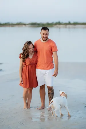 Happy family walking on the beach during vacation