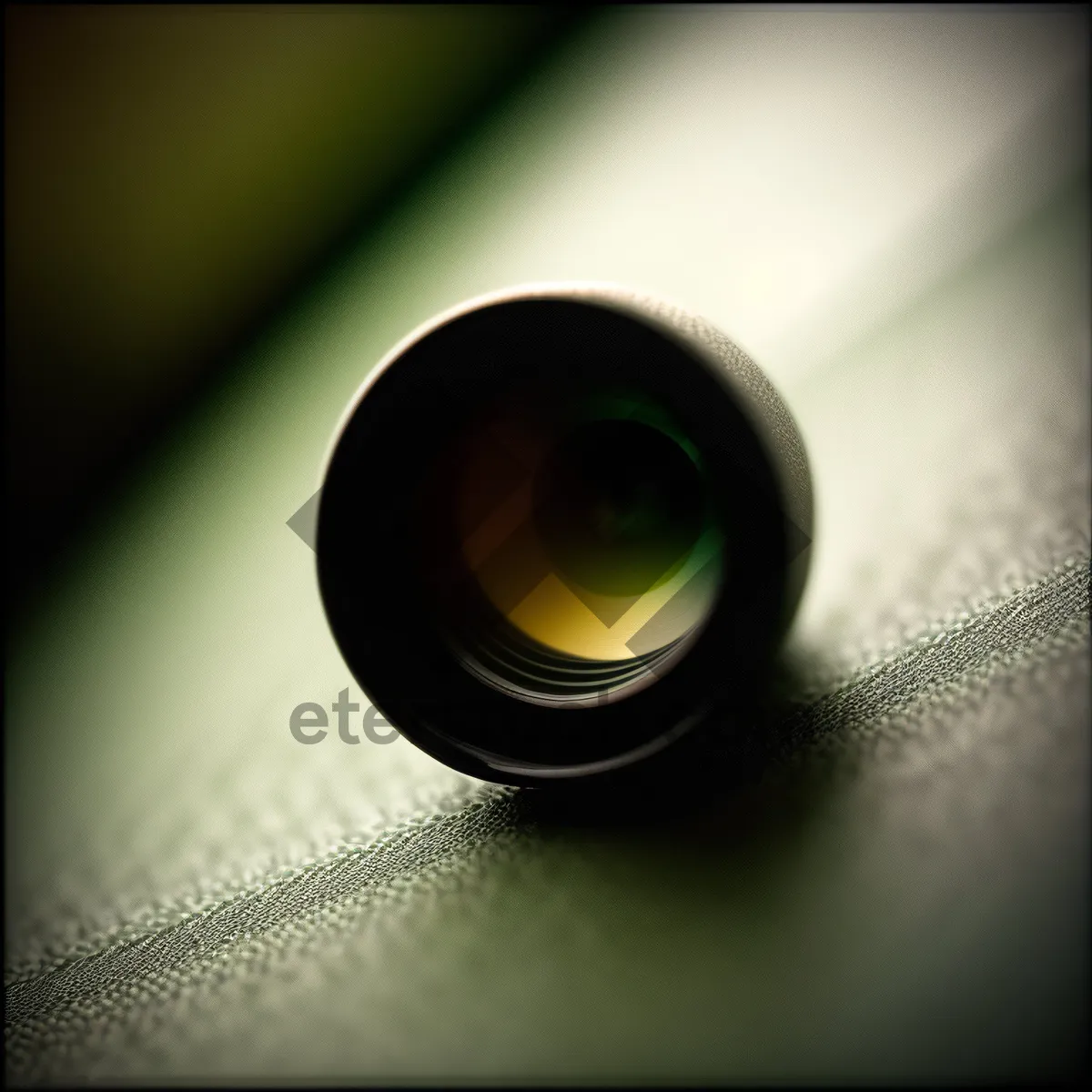 Picture of Hand holding a glass microscope, investigating light and black aperture in space.