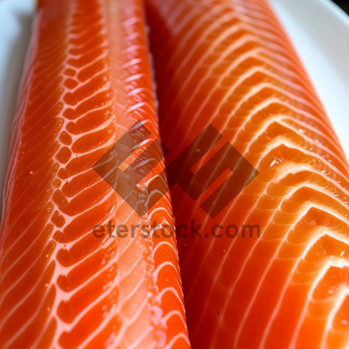Picture of Freshly prepared salmon fillet on orange bangle