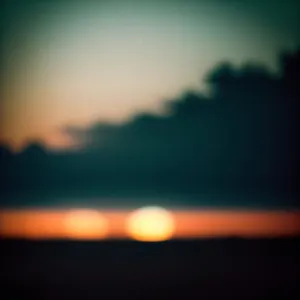 Majestic Horizon: A Stunning Sunset with Fiery Orange Sky