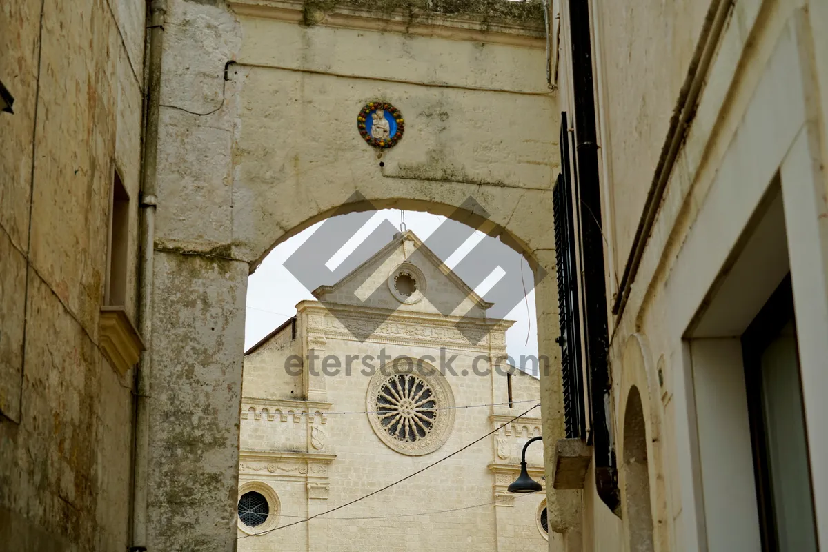 Picture of Historic Cathedral Tower with Cross and Arched Windows