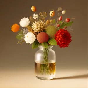 Yellow floral bouquet in glass vase centerpiece.