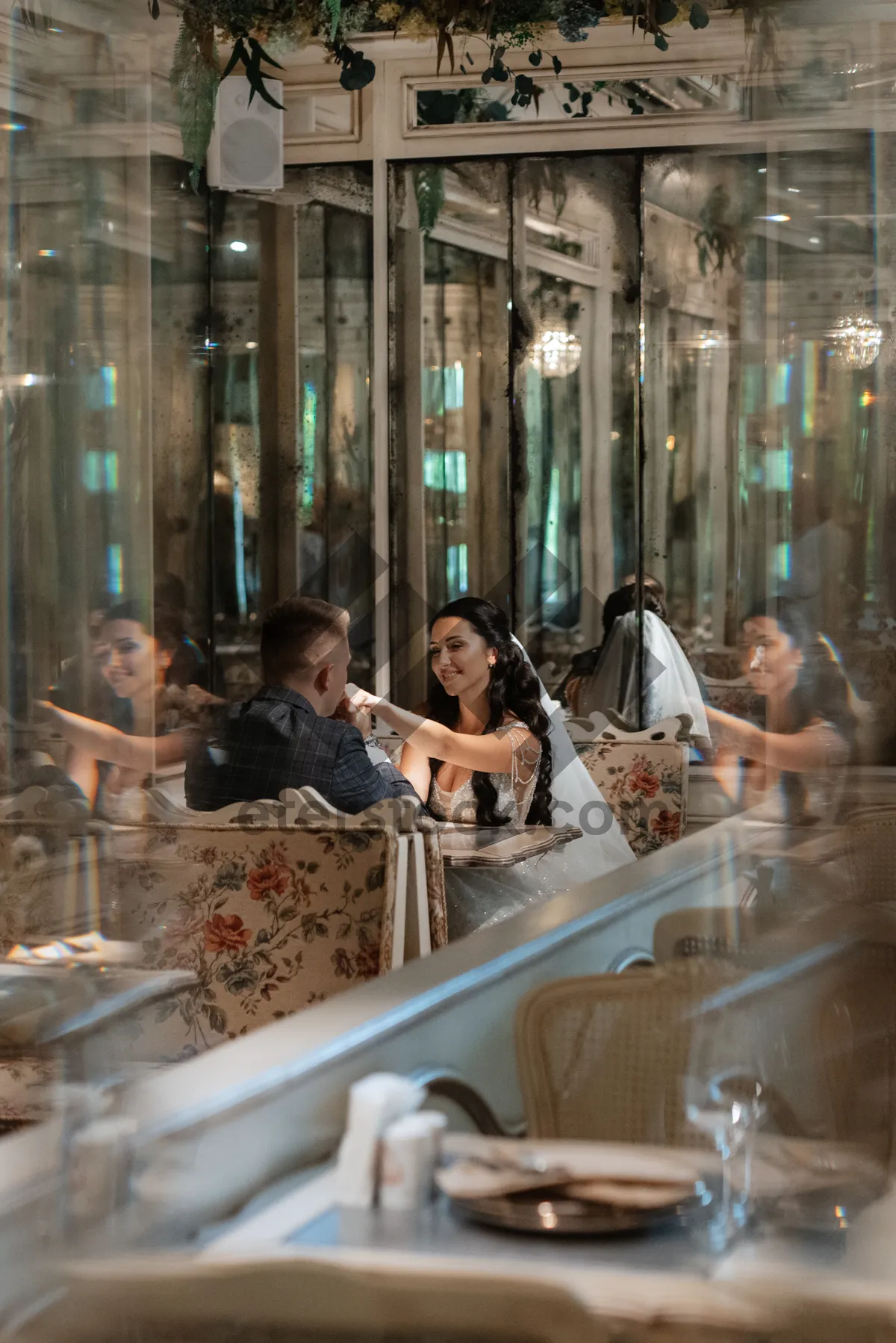 Picture of Happy couple dining at a restaurant table.