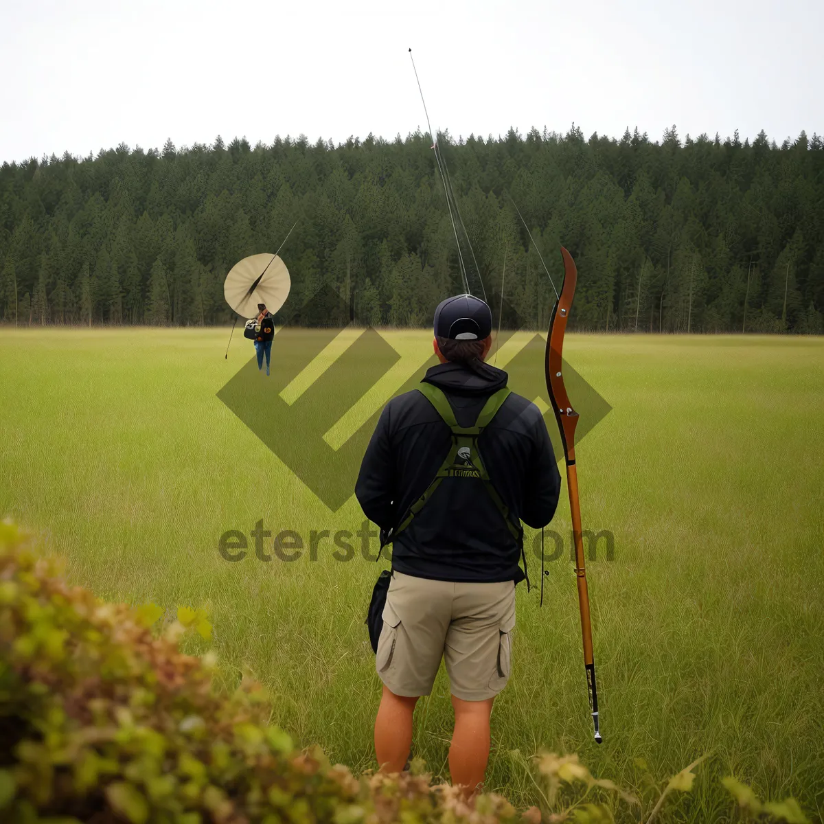 Picture of Active Golfer Swinging Club on Golf Course