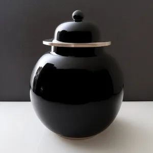 Traditional Teapot: Exquisite vessel for brewing aromatic tea.