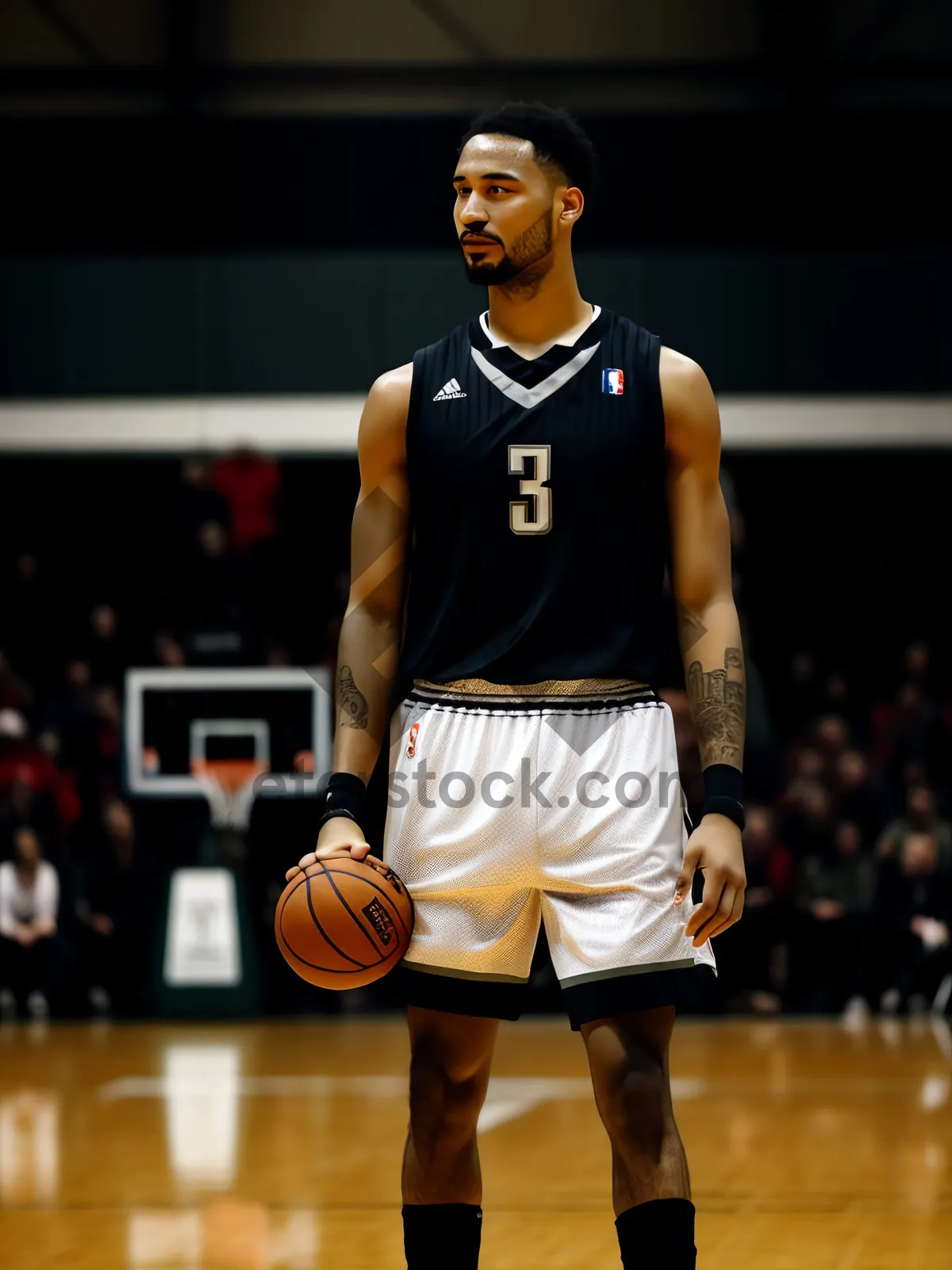 Picture of Fit Male Athlete Training with Basketball in Gym