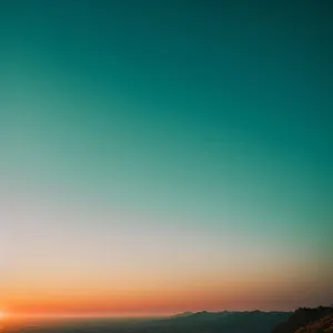 Sun-kissed countryside meadow under vibrant sky