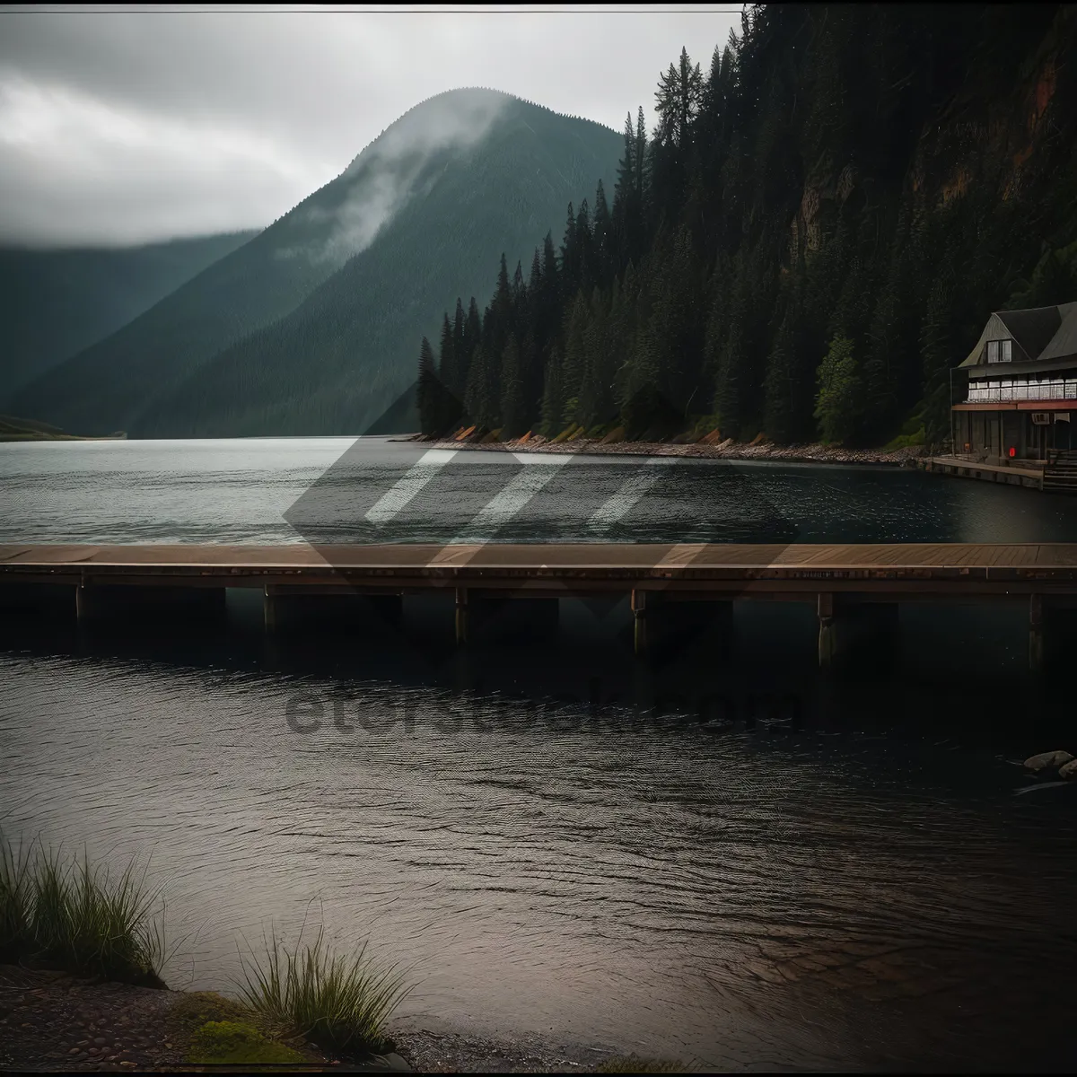 Picture of Serene Sunset Over Majestic Mountains at Lakeside