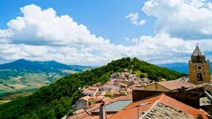 Historic church building in picturesque mountain village landscape.