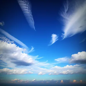 Golden Summer Sky: Vibrant Sunlit Clouds and Clear Blue