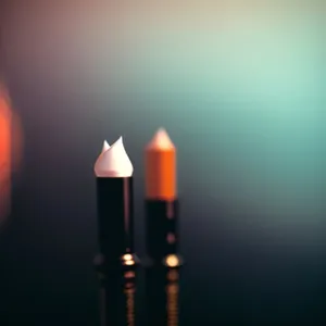 Colorful Lipstick, Pencil, and Flame