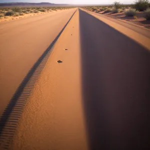 Dune Adventure: Aerial View of Desert Landscape and Highway