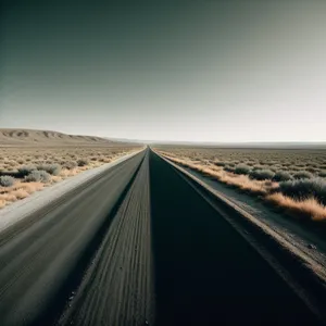 Endless Road: Speeding Through Desert Landscape