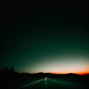 Sunset Over Mountainous Landscape