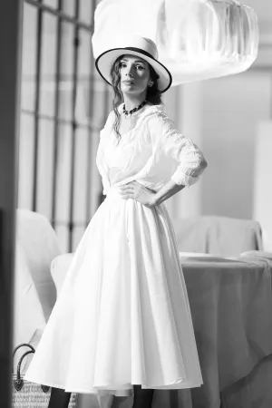 Happy Bride in Wedding Gown Holding Flower Bouquet