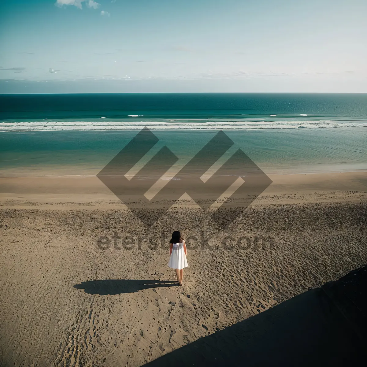 Picture of Tropical beach vacation getaway with calm waves rolling in.