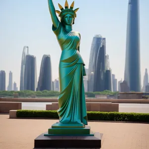 Monumental Freedom: Iconic Statue Amidst Historic City Skyline