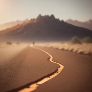 Vast Desert Dunes with Scenic Sunset