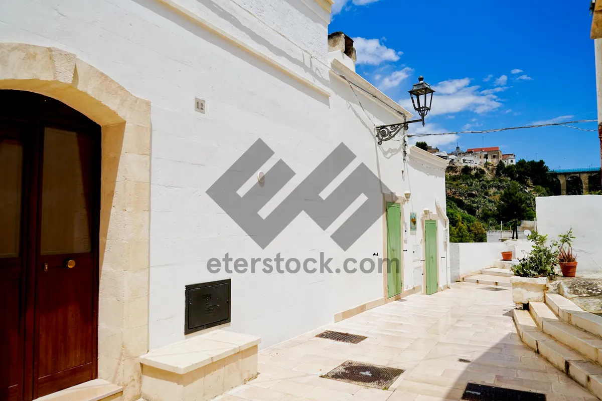 Picture of Stucco house in the city skyline