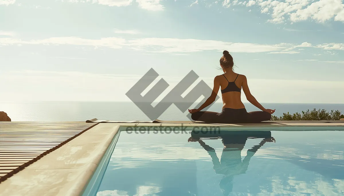 Picture of Man sitting on beach chair in tropical resort hotel