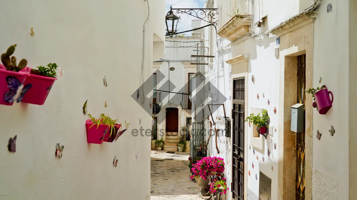 Picture of Old town building with stone walls and balcony.