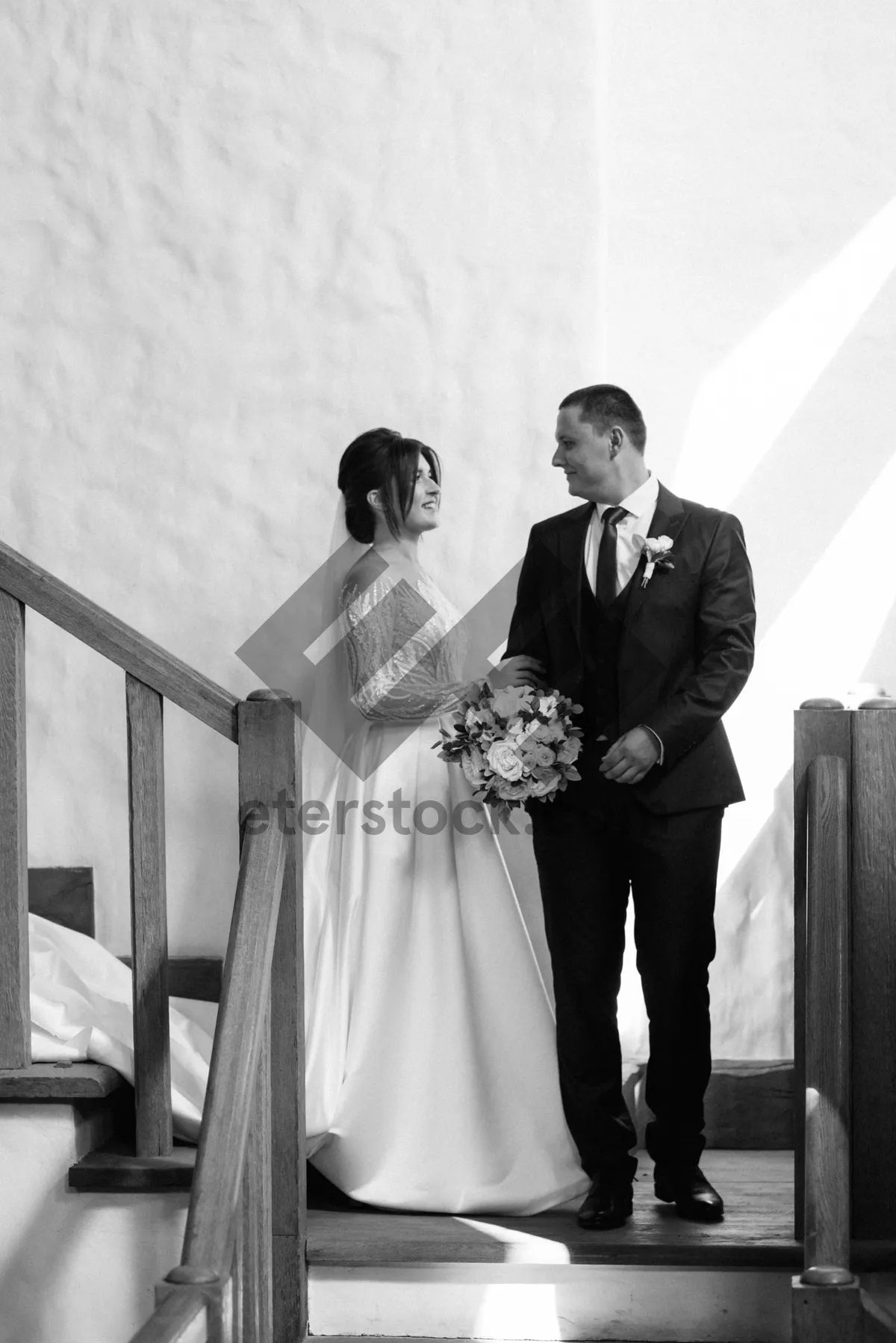 Picture of Happy Wedding Couple Celebrating Marriage with Bouquet