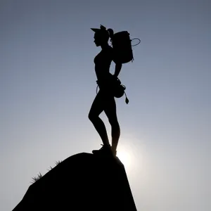 Skyward Leaper: Silhouette Statue Caught Mid-Jump