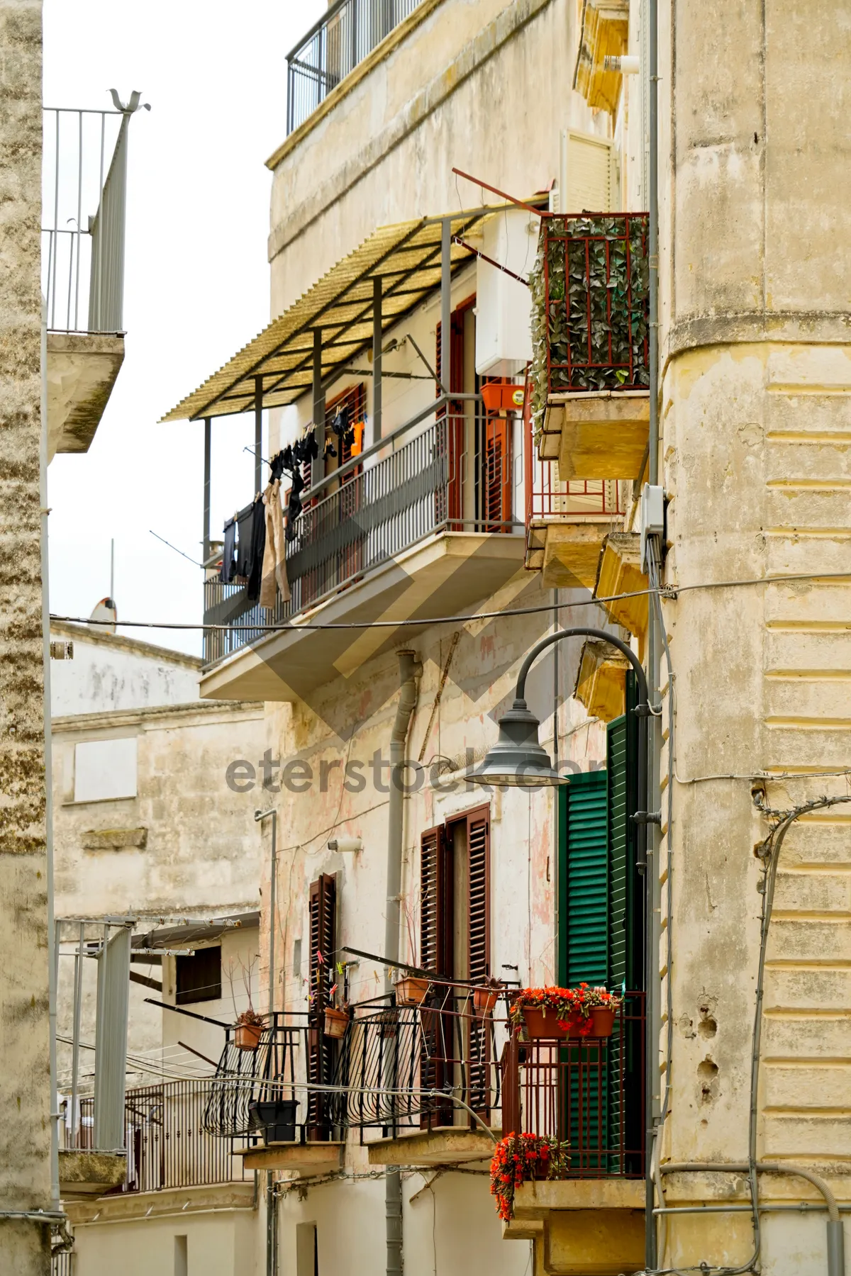 Picture of Old city architecture with ancient balcony and windows.