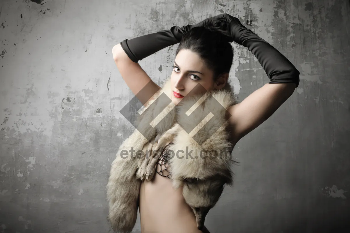 Picture of Fashion model in fur coat posing sensually