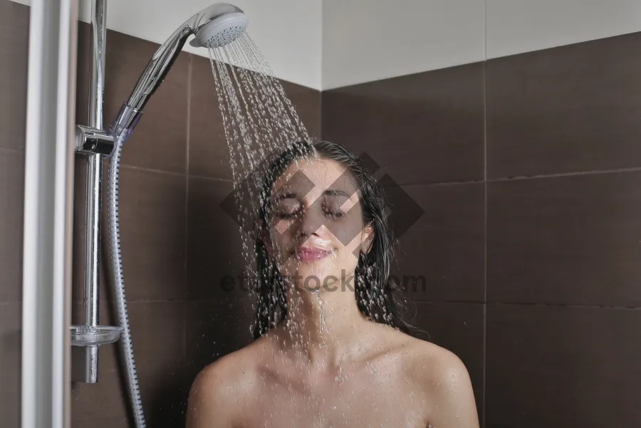 Picture of Attractive brunette lady in steamy shower portrait.