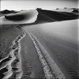 Dune-bound Bullet Train Rapidly Crossing Sandy Landscape