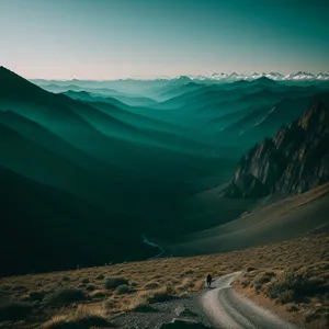 Highland Sunset over Majestic Mountains and Valley