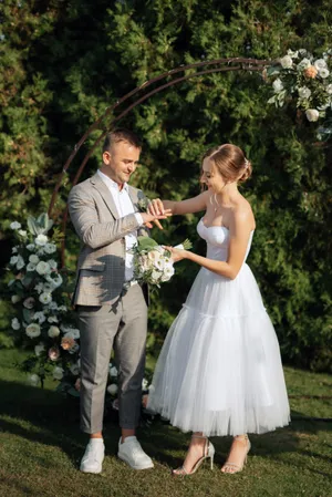 Happy couple celebrating outdoors on their wedding day