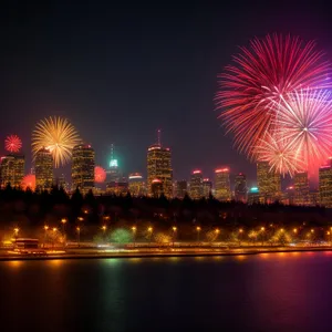 Nighttime Fireworks Reflection over City Skyline