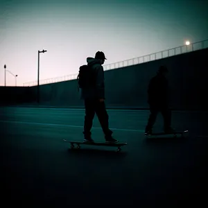 Skateboarder carving on sunset-lit slope.