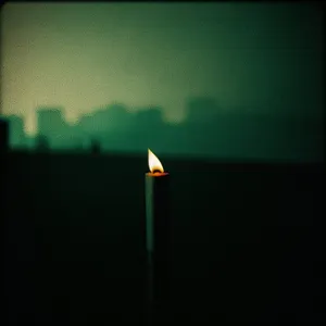 Glowing Candle in the Dark
