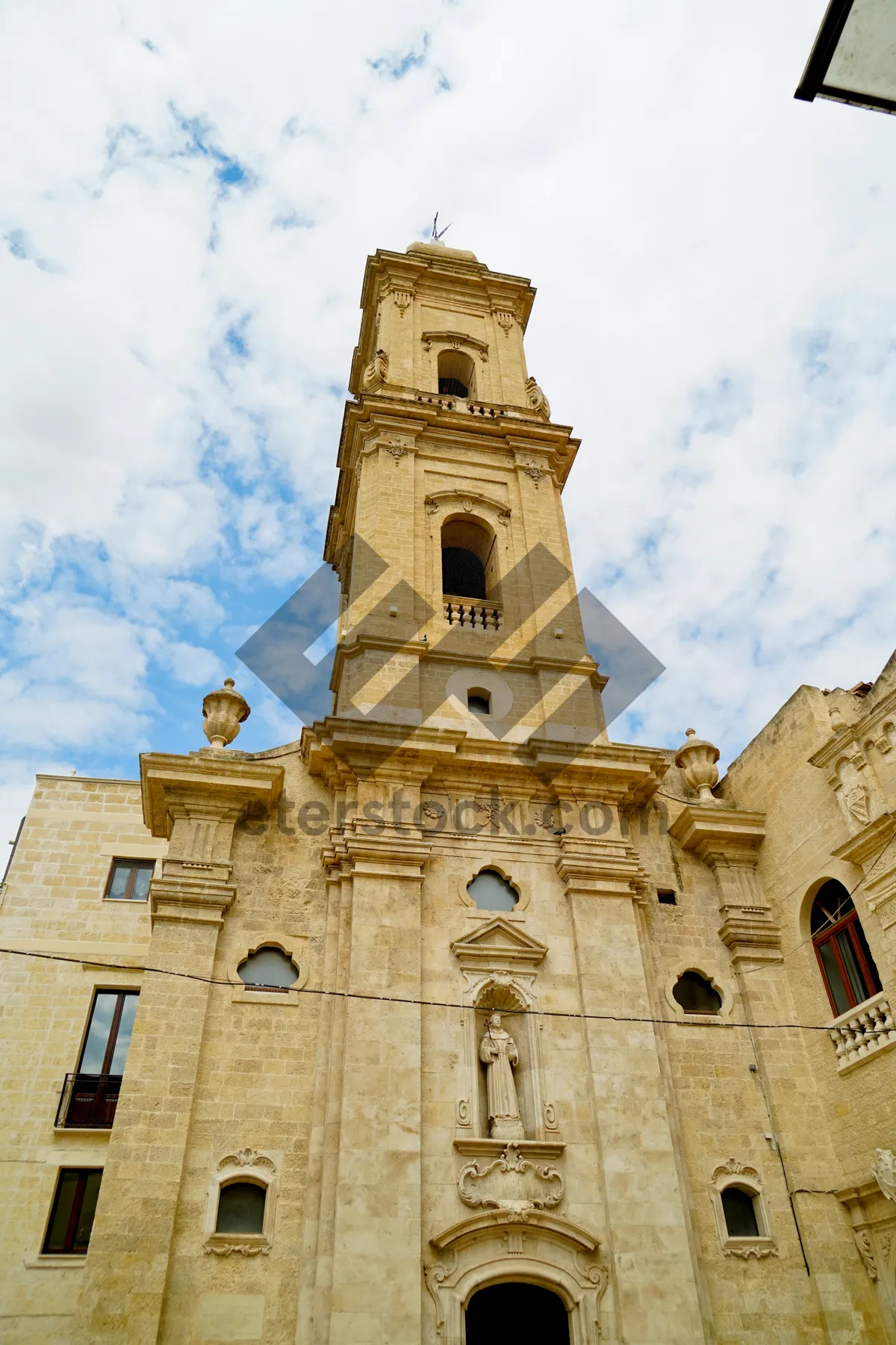 Picture of Historic cathedral tower in the city skyline.