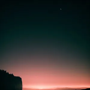 Vibrant Sunset Silhouette over Summer Landscape