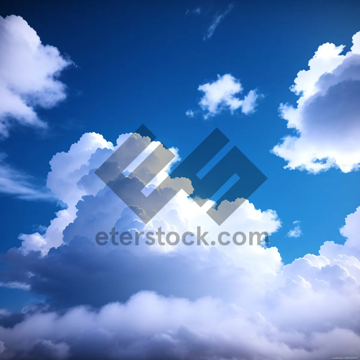 Picture of Fluffy Cumulus Clouds in Sunlit Sky