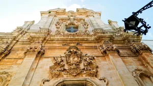 Historic Cathedral and Statue in Ancient Cityscape