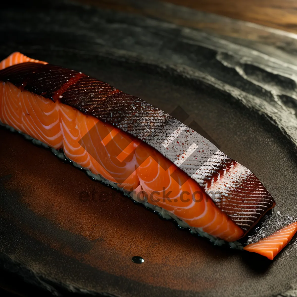Picture of Knife blade and salmon on cutting board