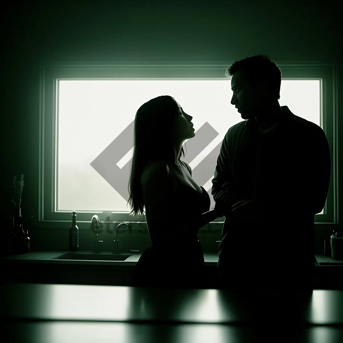 Picture of Silhouette of a Man Sitting at Desk in Office